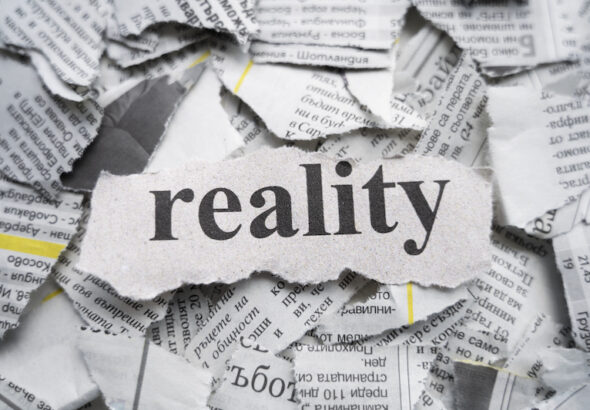Tidningsutklipp med texten reality